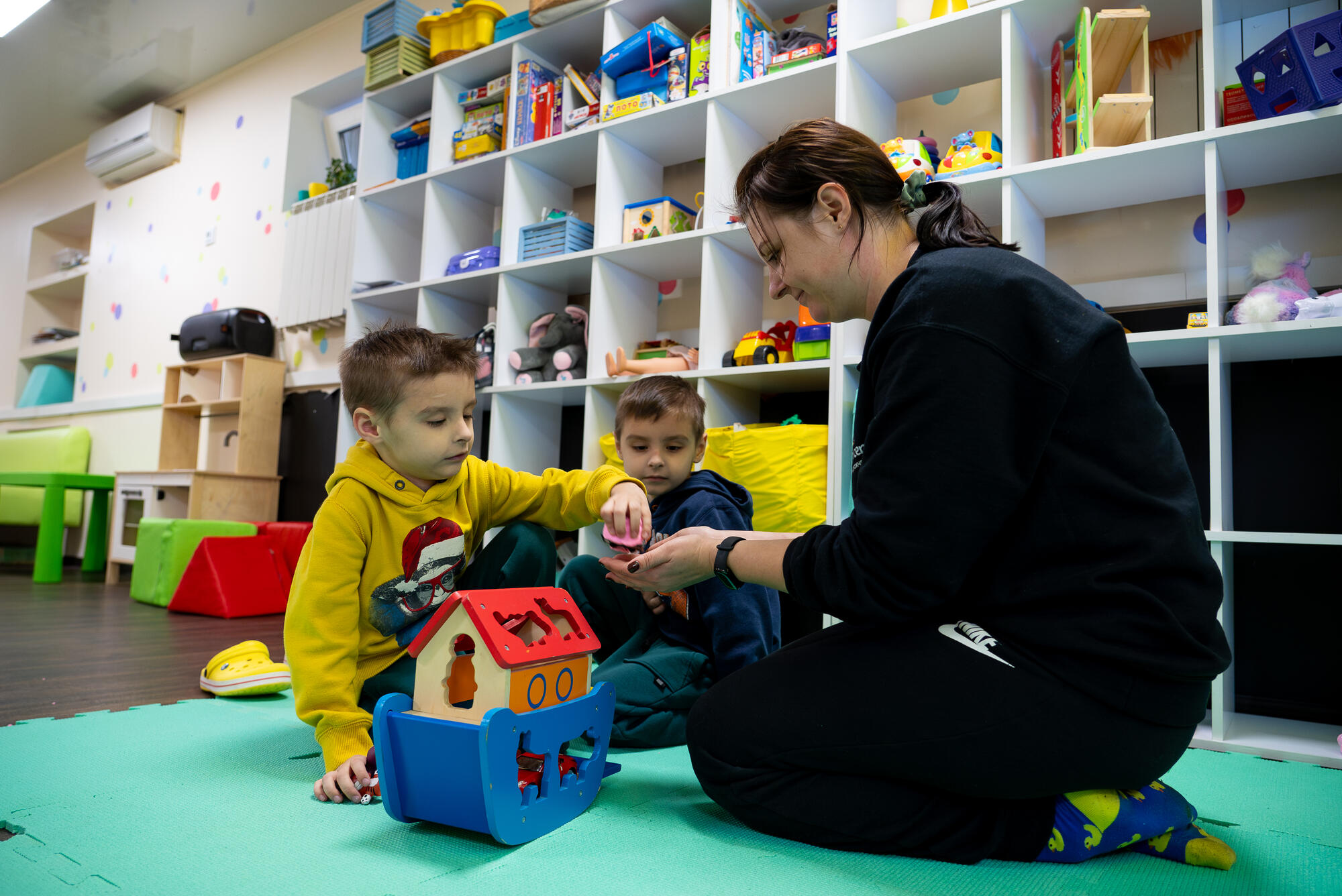 Ukrainian children playing with toys in a children's centre
