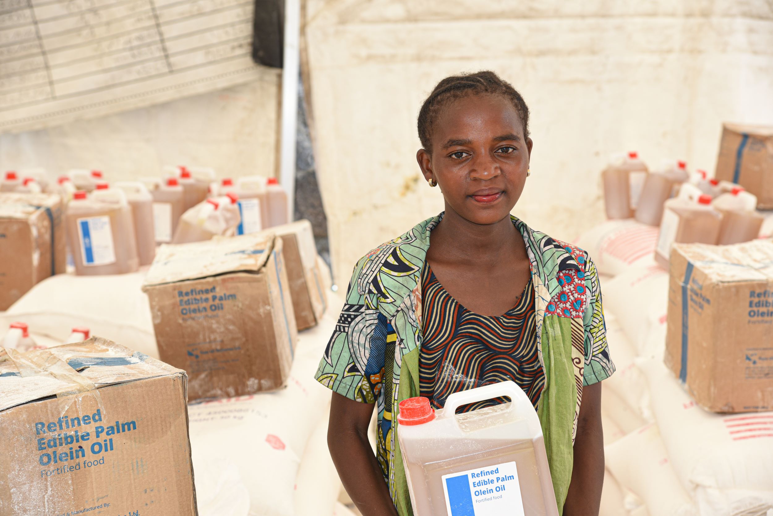 Girl from the Democratic Republic of Congo case of palm oil