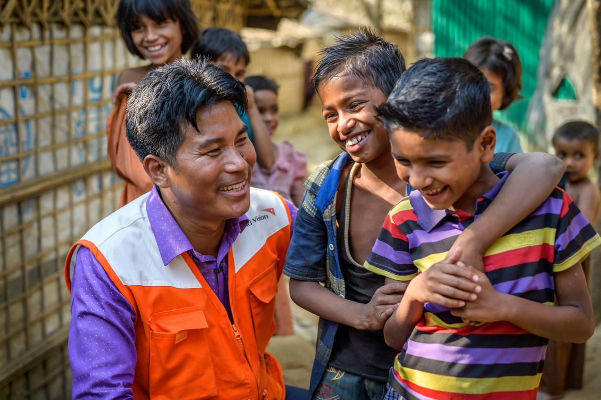 Atul Mrong, a former sponsored child, speaks to Rohingya children in Myanmar