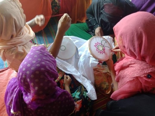 Girls sewing.