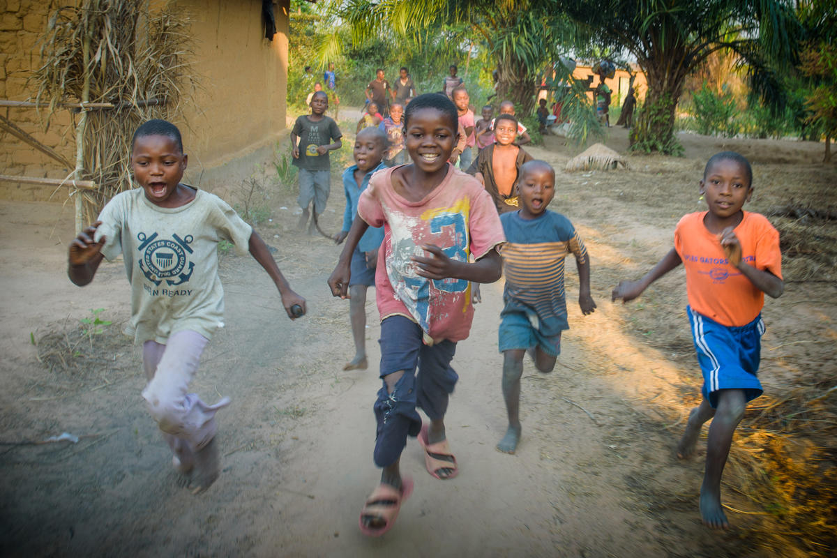 Children run towards the camera