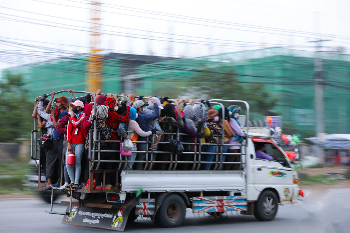 Truck filled with people in Cambodia