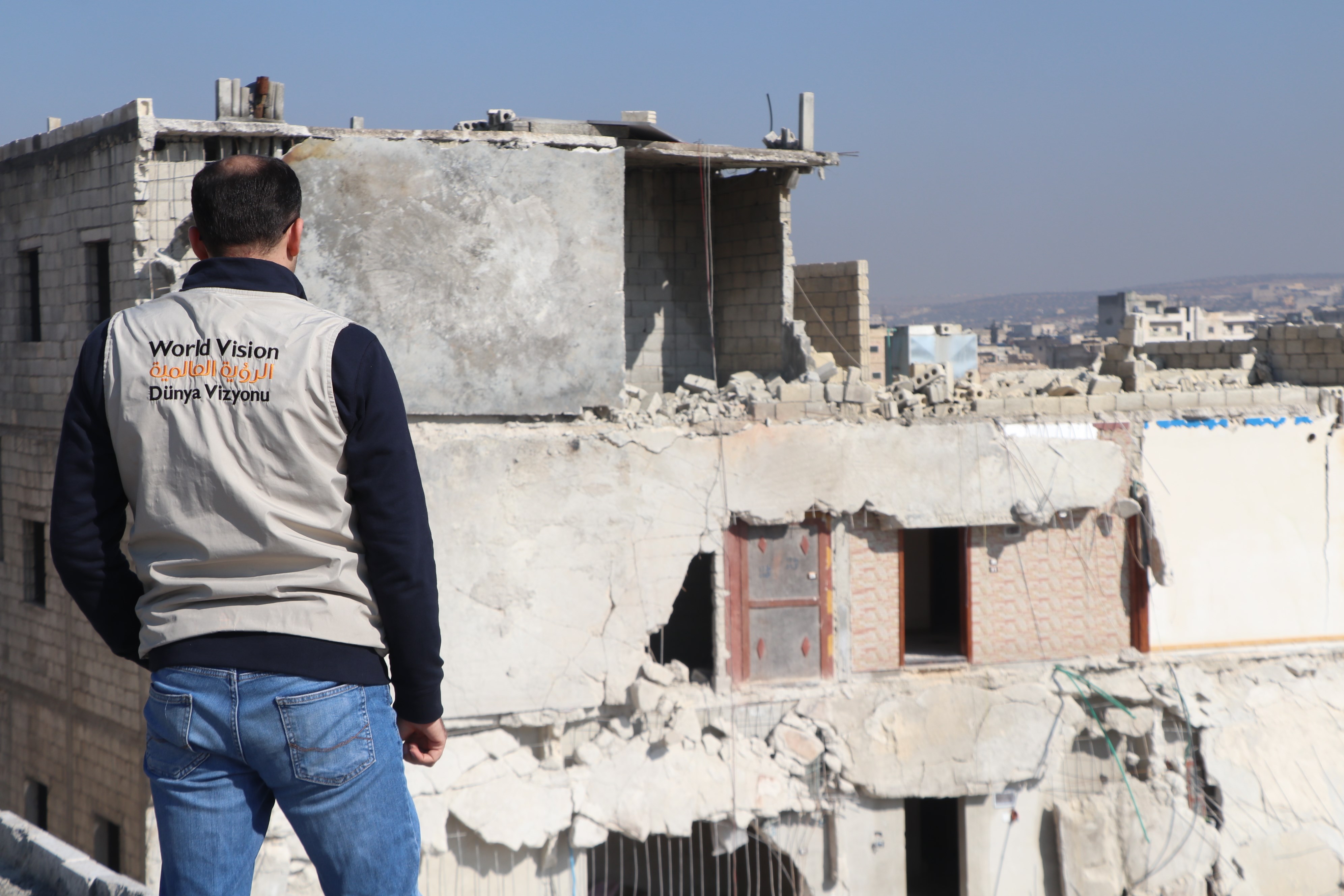 World Vision staff walk past rubble caused by the 2020 Beirut explosion