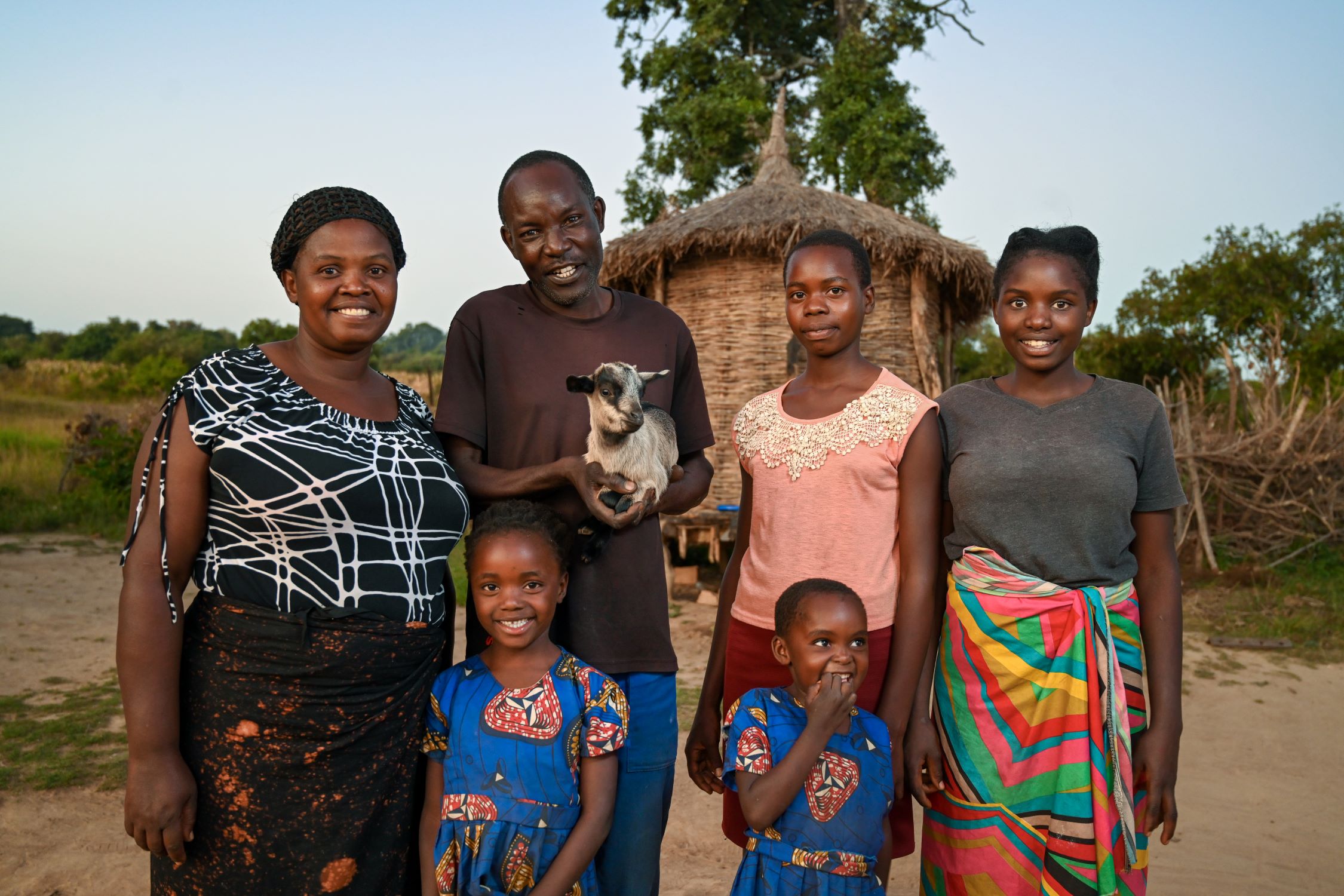 Zambian family stand together and smiling