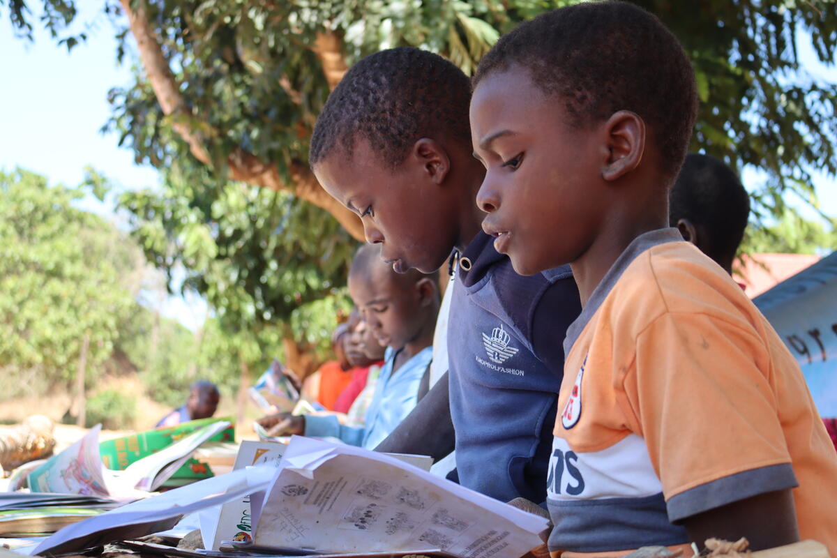 Children reading books.
