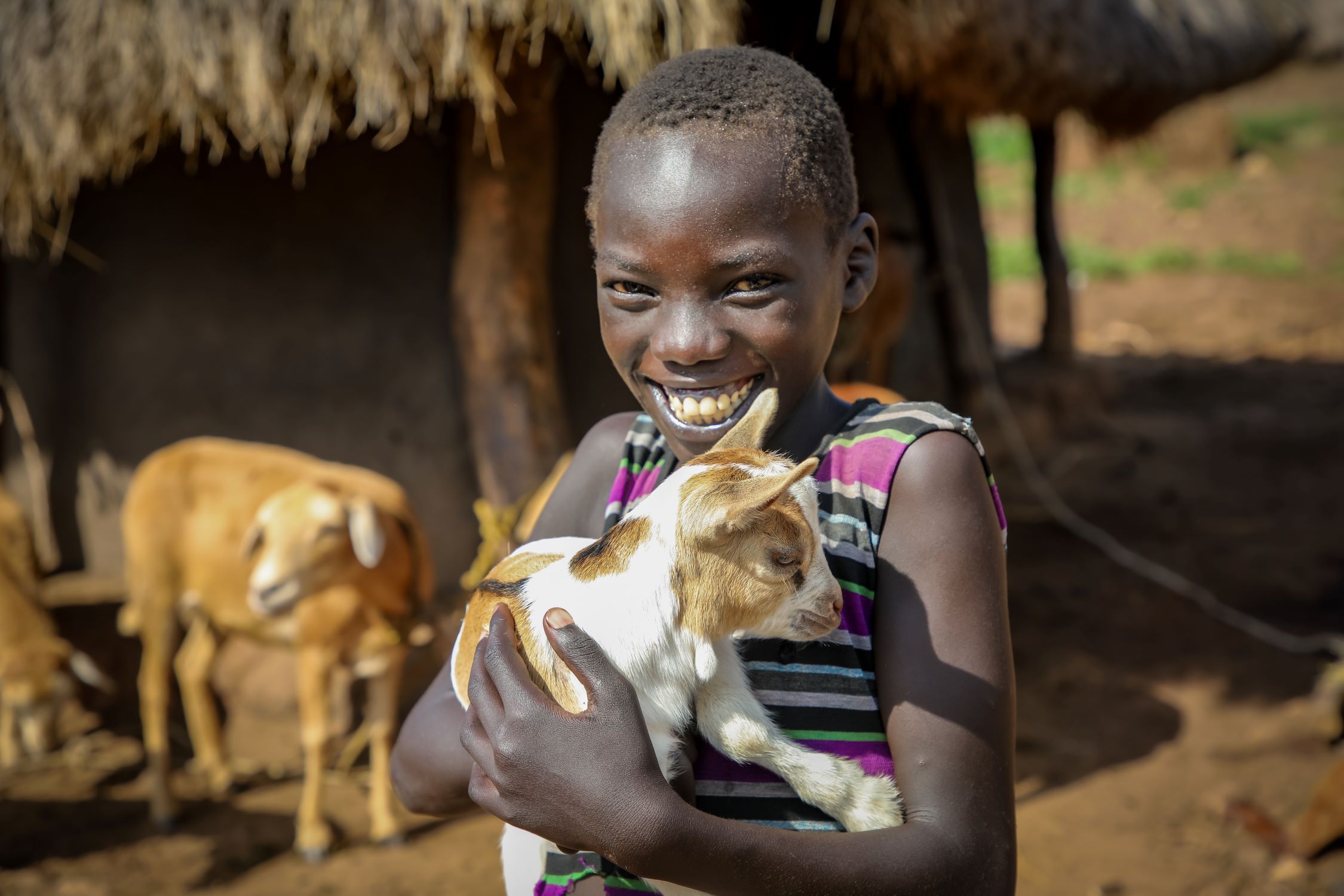 African boy with goat