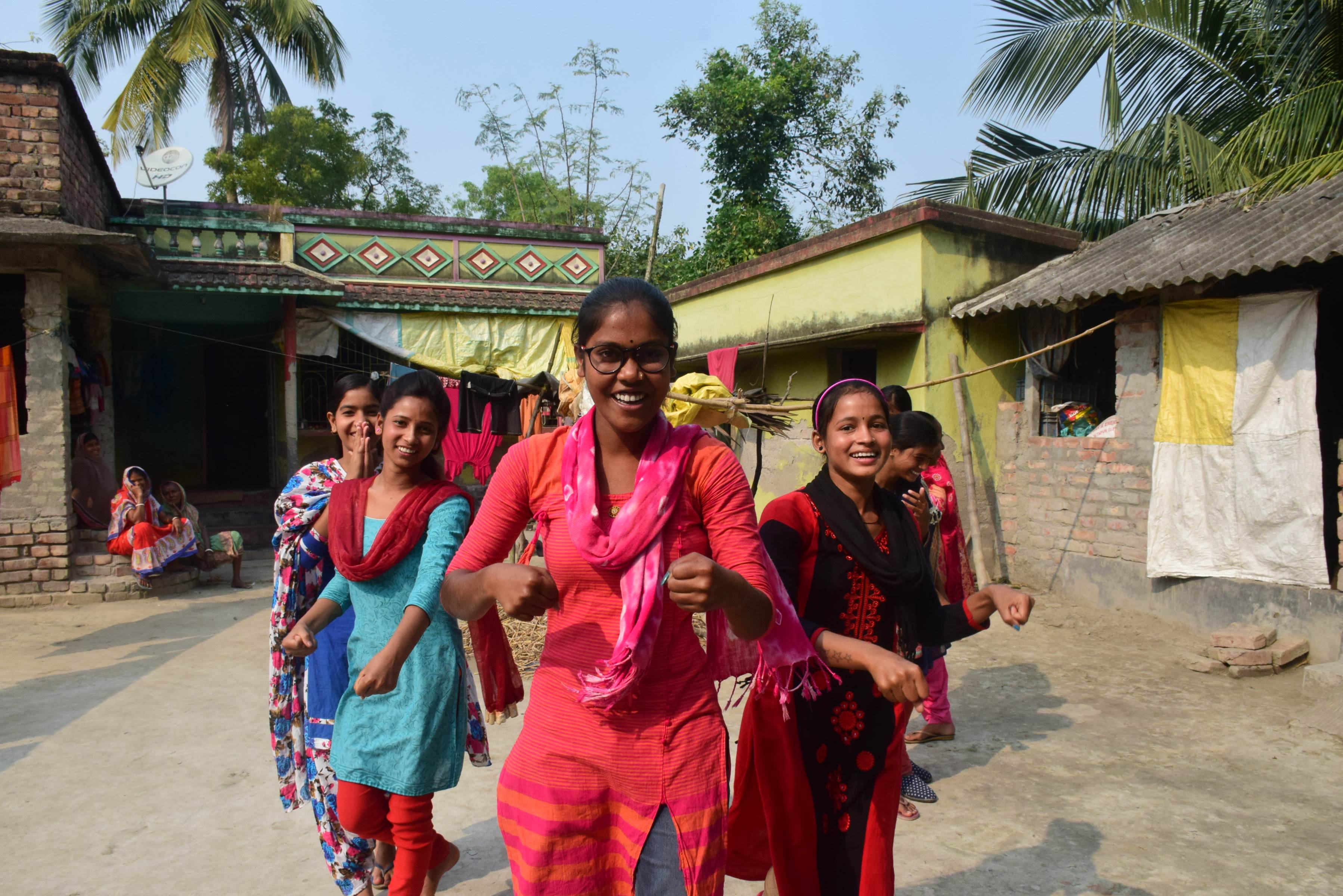 Girls in India show off the protection skills they learnt in a girls protection class