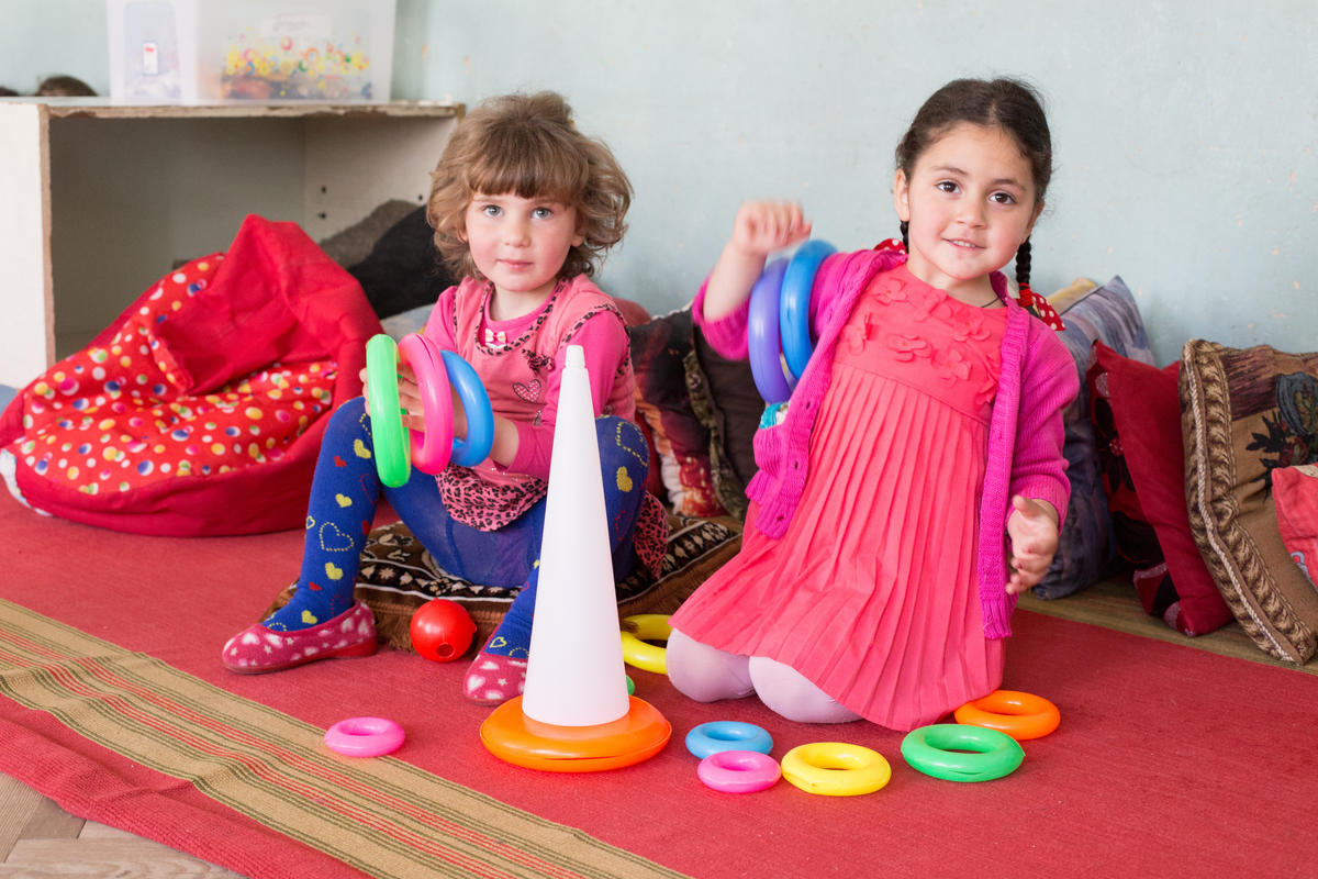 Two children play together in a kindergarten in Georgia that is inclusive to children with disabilities