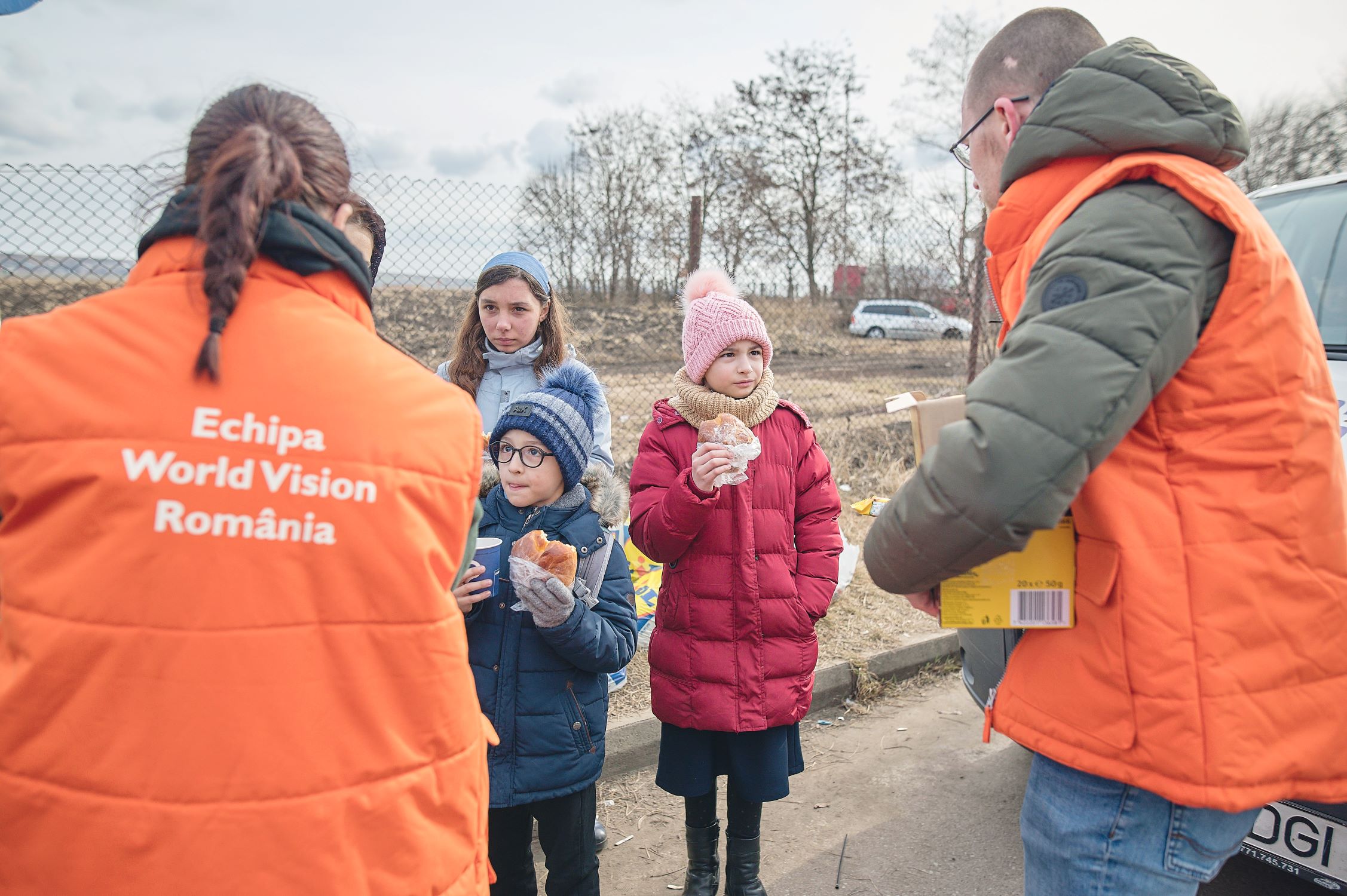 Ukrainian refugee children meet World Vision staff at the boarder