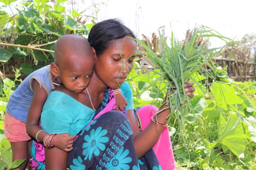 Priya and her mum tend the vegetables together