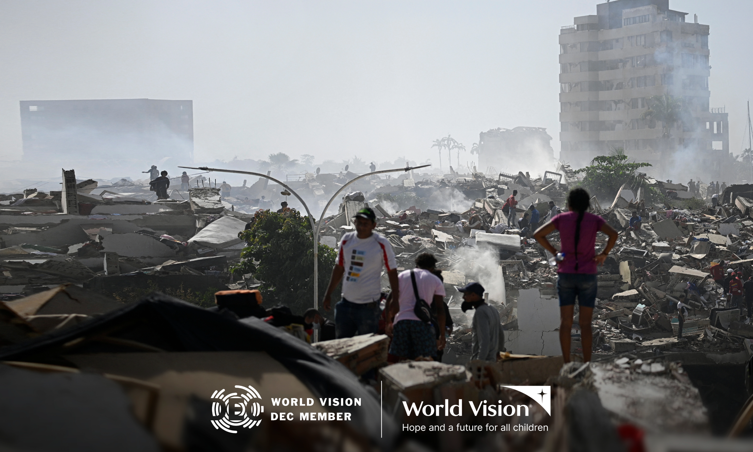 People search for survivors amongst collapsed buildings