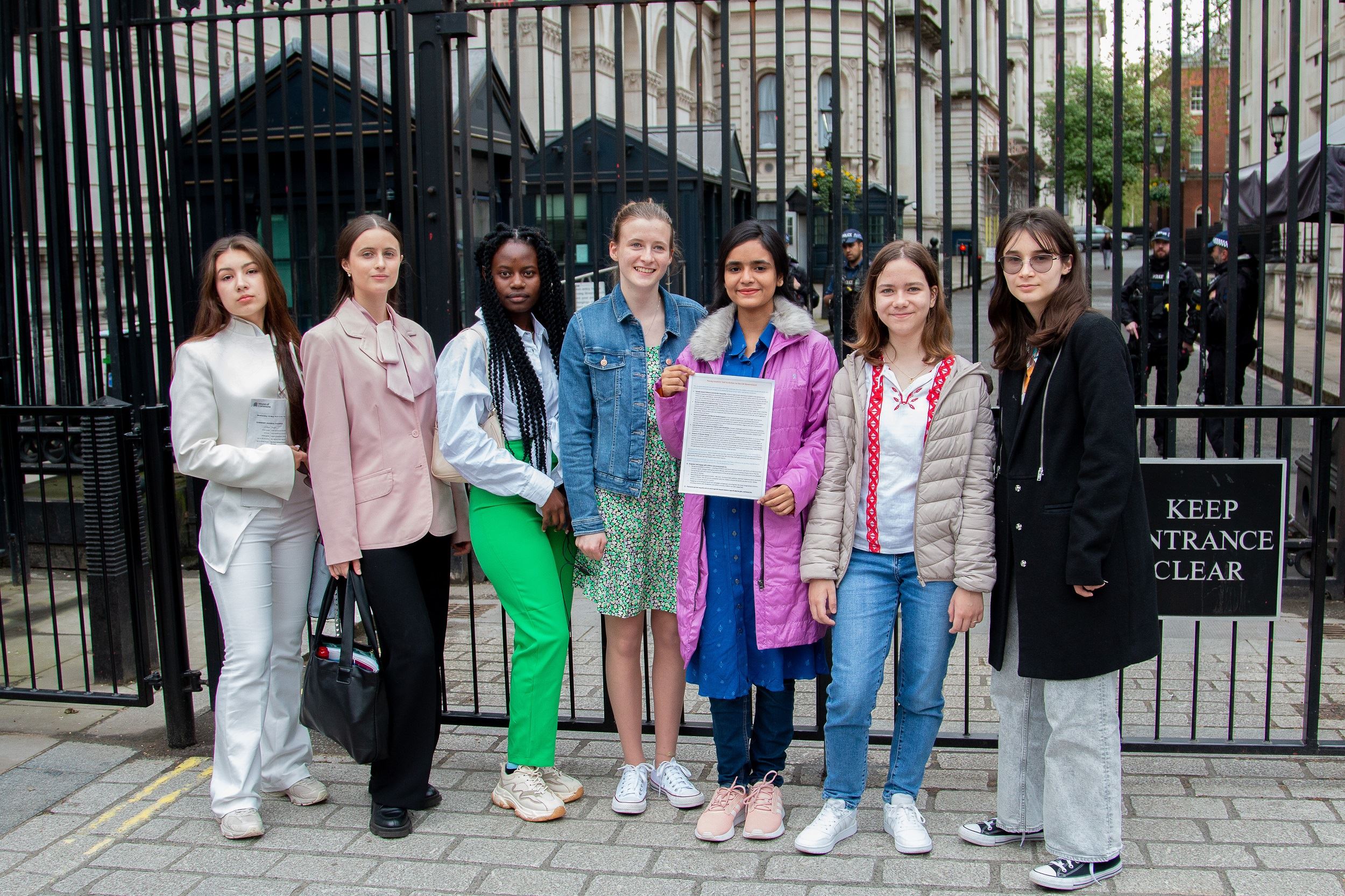 Teenage 'changemakers' from around the world stand outside the gates of Downing Street