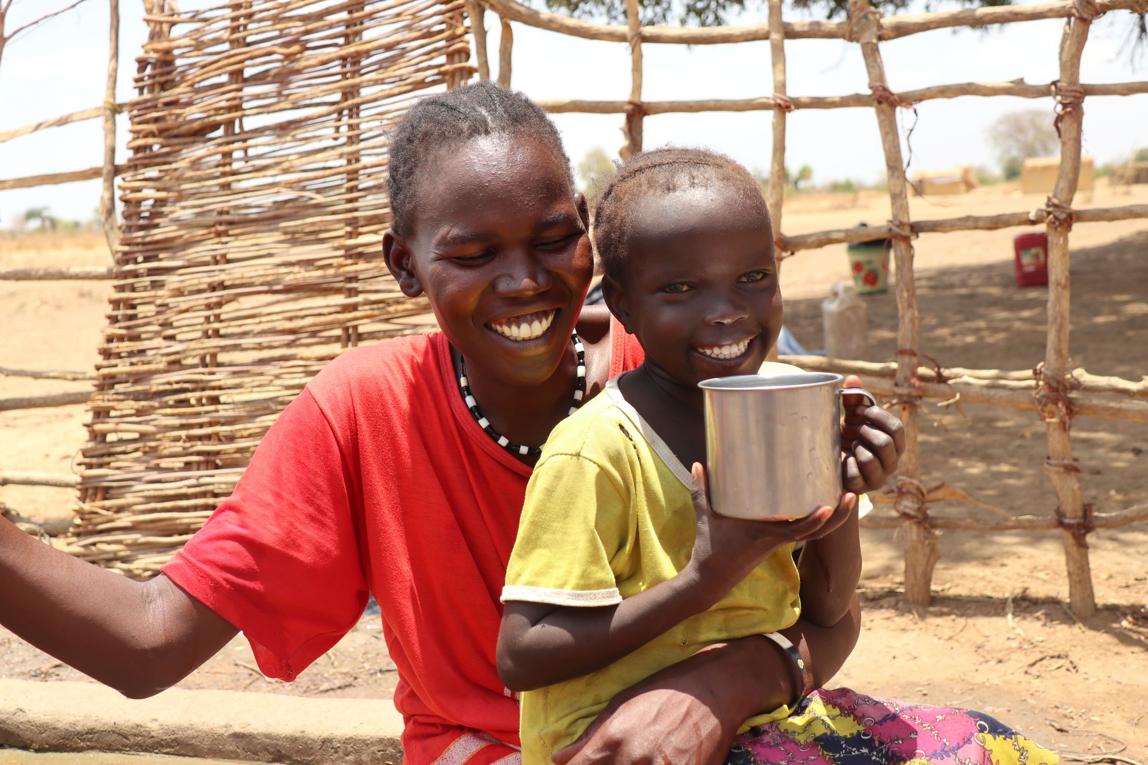 Mother and child enjoying drinking clean water